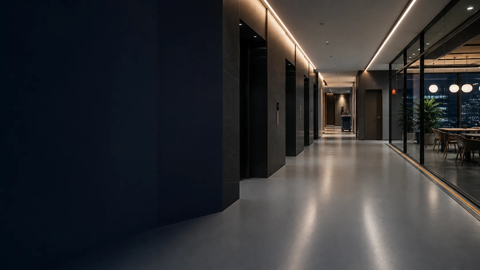 After-hours Singapore office lift lobby, corridor and grey resin flooring