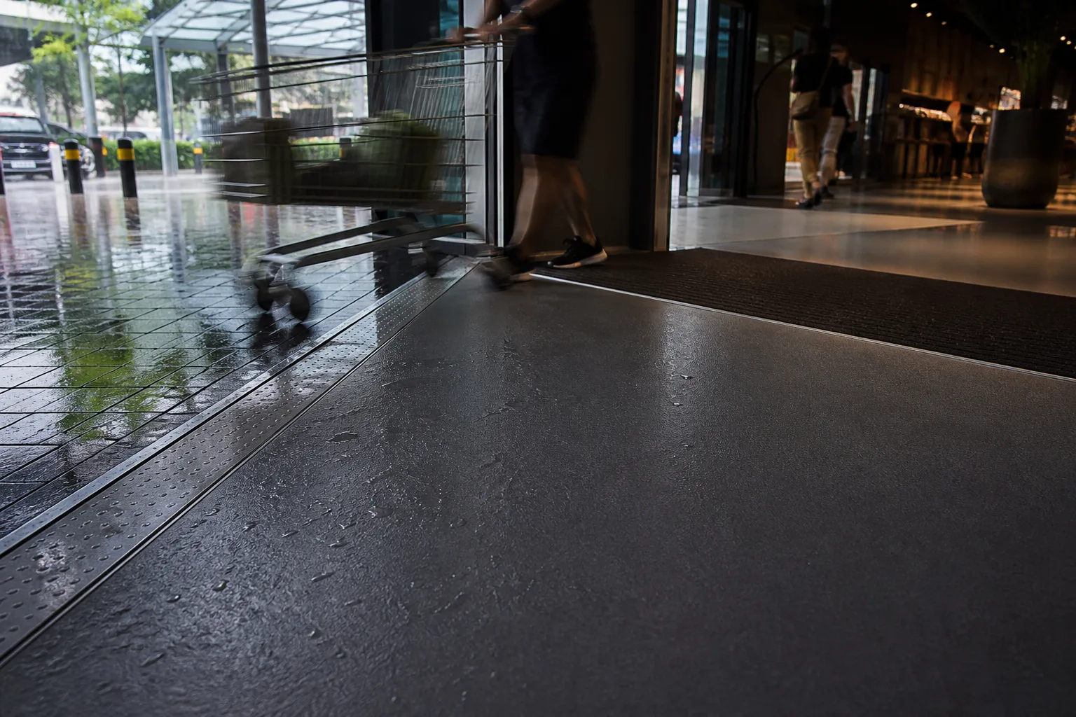 Singapore mall entrance mat, threshold, trolley and slip-resistant resin floor during rain